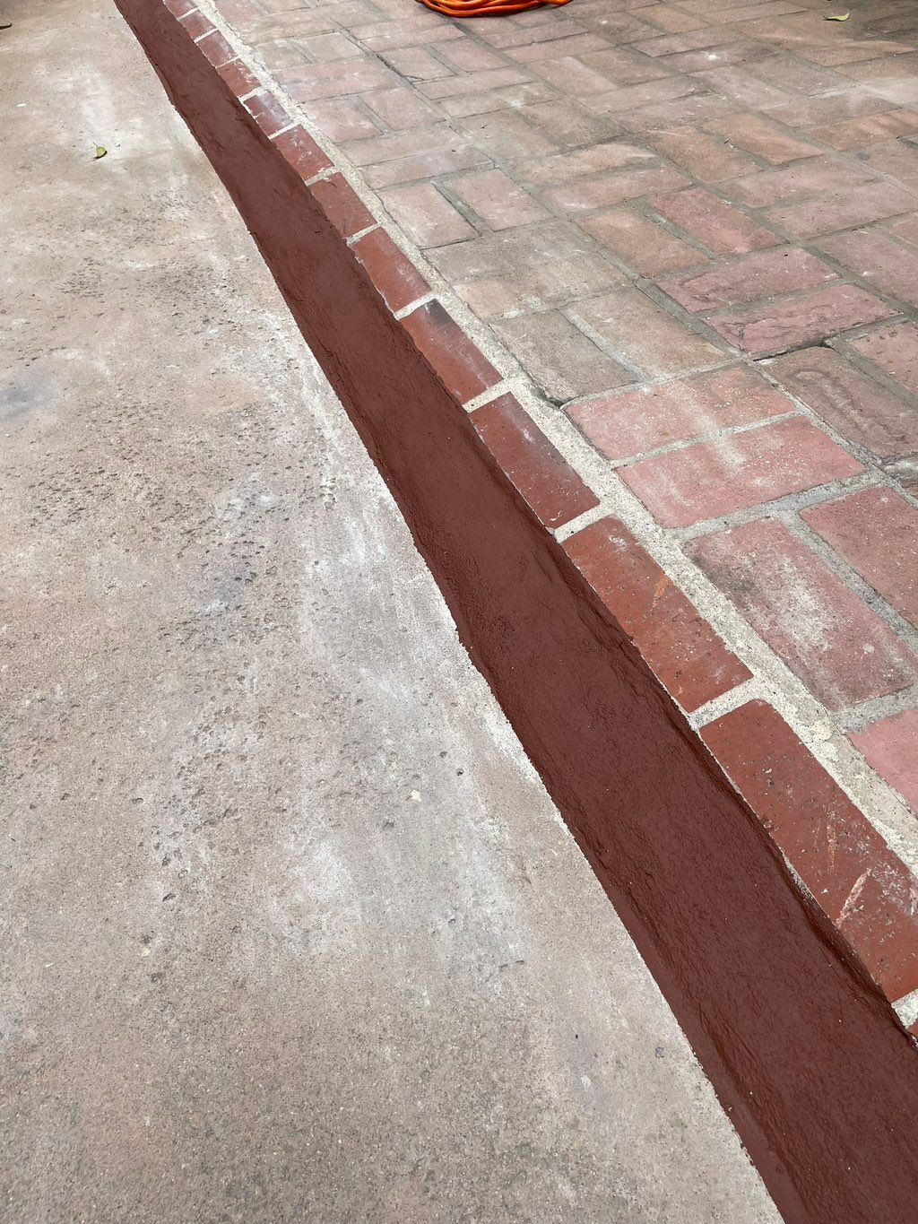 Exterior/resealed brick scene with stucco as water