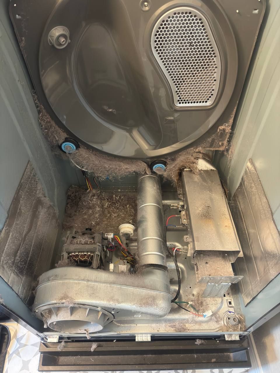 Dryer overheated due to heavy lint buildup, causin