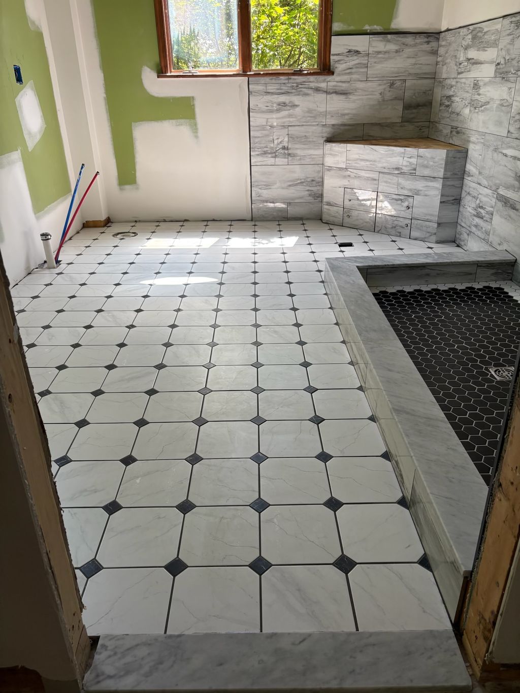 Tile shower with framed hexigon floor and tile flo