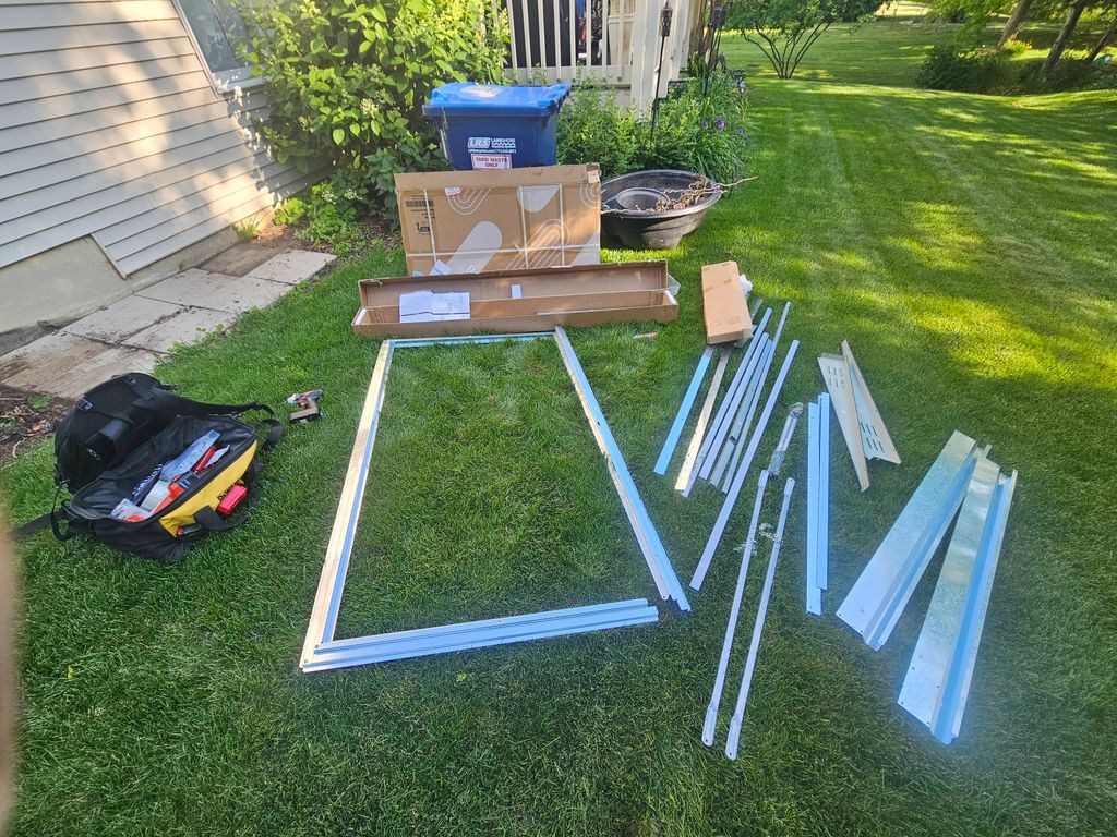 Before picture of a metal shed assembly