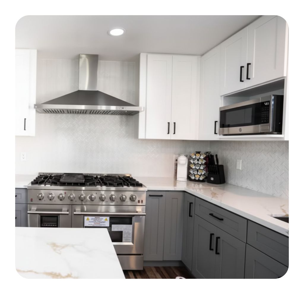 Kitchen detail clean: range, hood, and backsplash 
