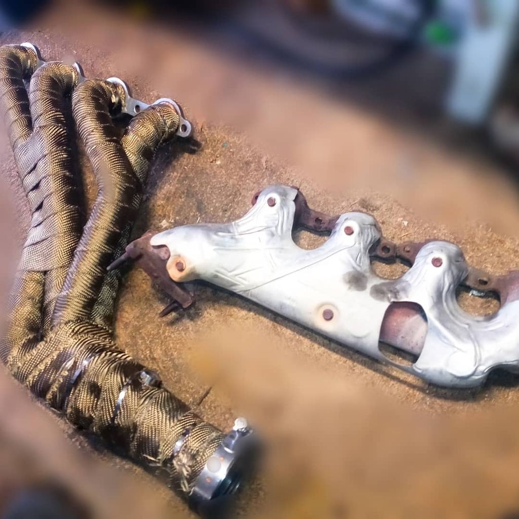 long tube headers heat wrapped with v-band clamps 