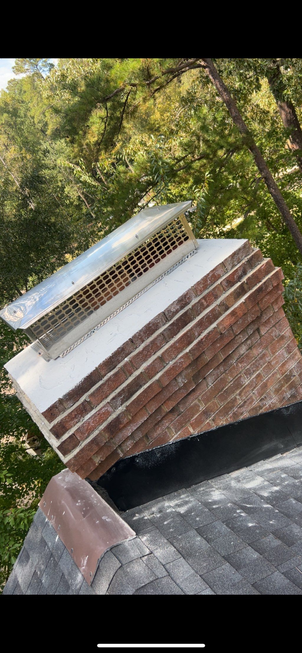 New stainless steel chimney cap and crown installe