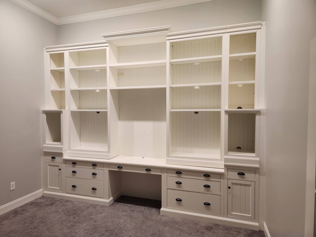 Built in office shelving system with custom trim a