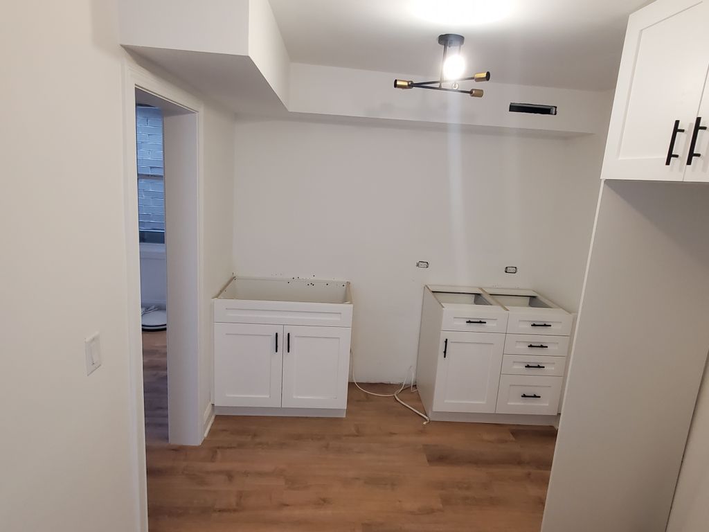 Kitchen Cabinets, flooring and electrical done