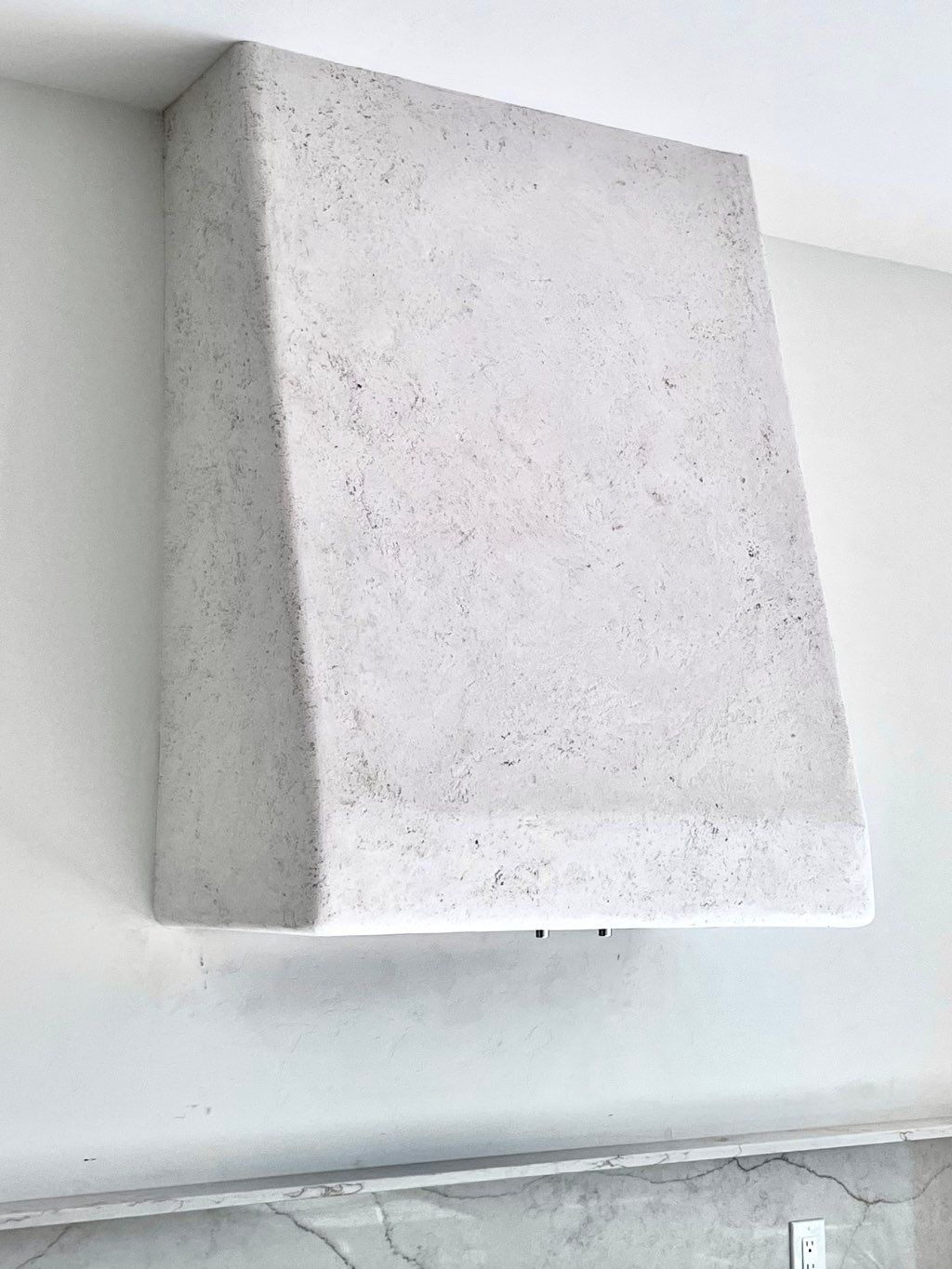 Italian plaster stove hood