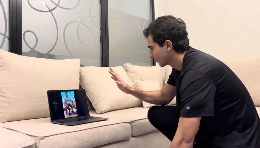 Student saying "hi" to his trainer