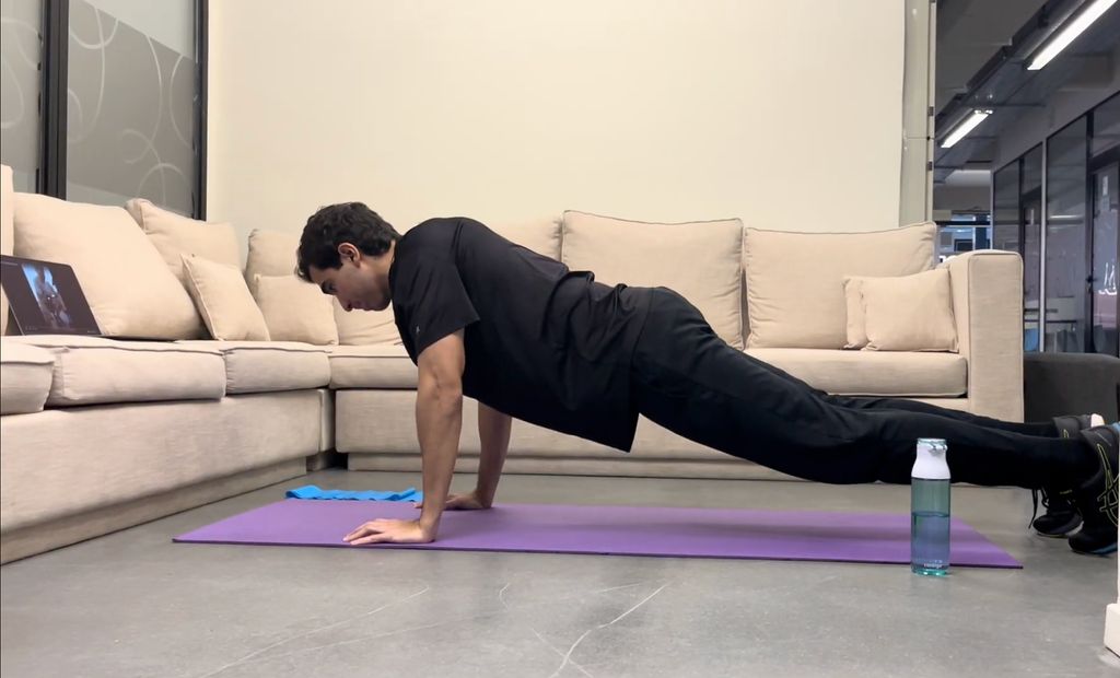 Student performing a plank