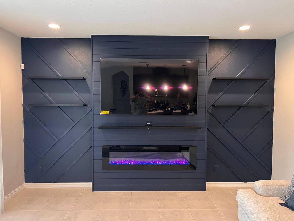 Custom media wall with electric fireplace and TV m
