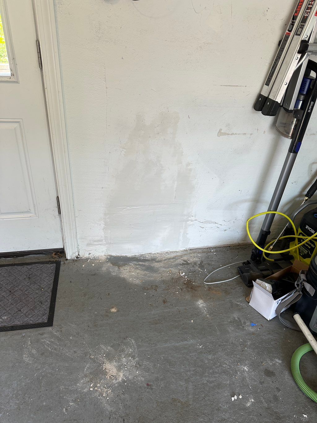 Fixed crack on garage wall to match texture