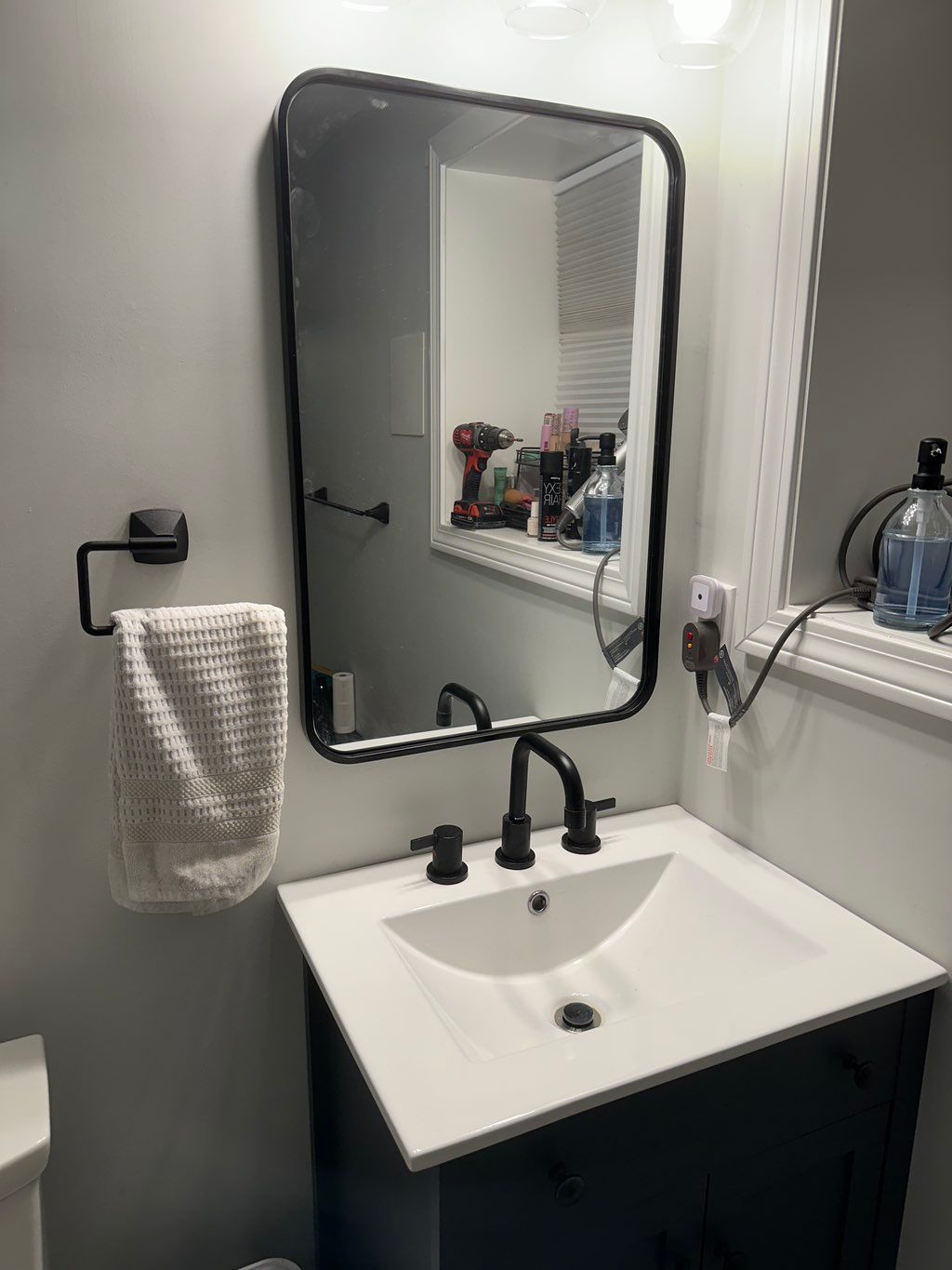 Reachorred and leveled bathroom mirror to stud
