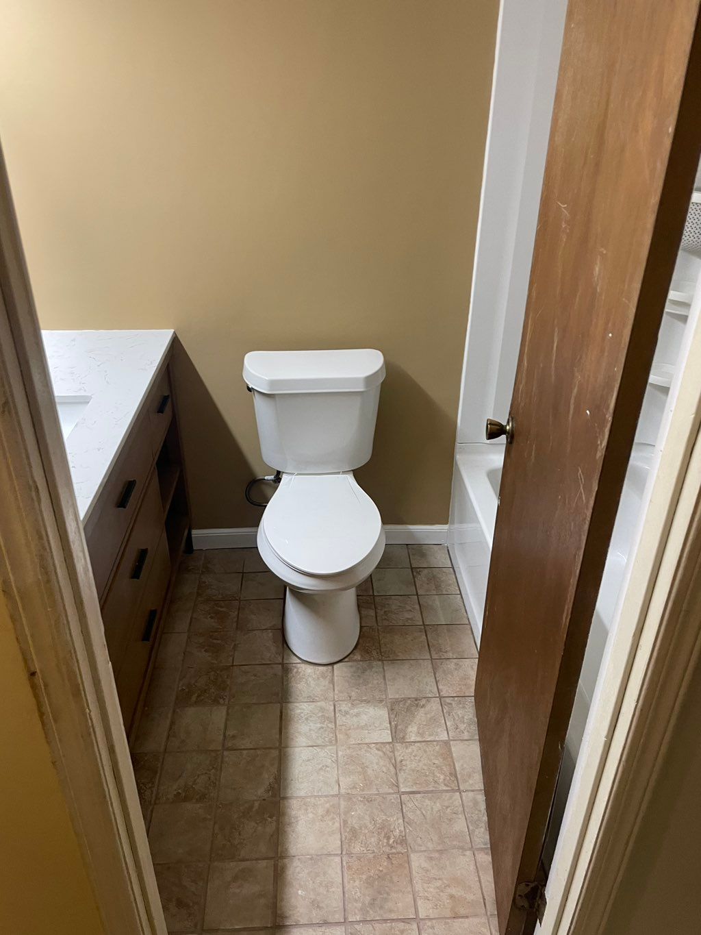 Bathroom remodel with new floor, paint and vanity.
