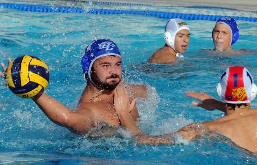An action shot of Coach Dalin playing water polo.