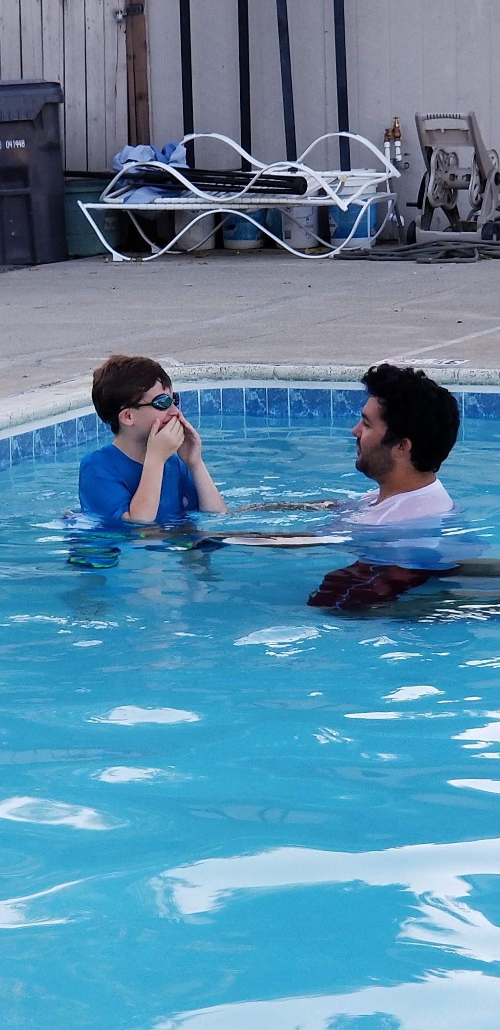 Coach Dalin providing a swim lesson to a beginner 