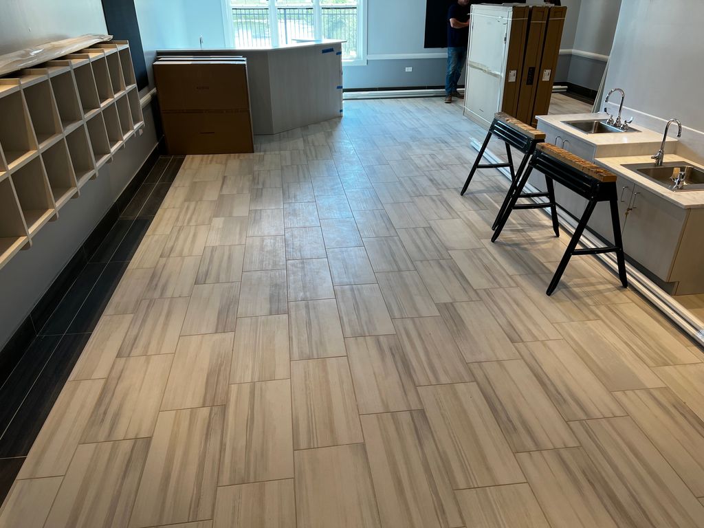 Tile installation with boarder at Children Learnin