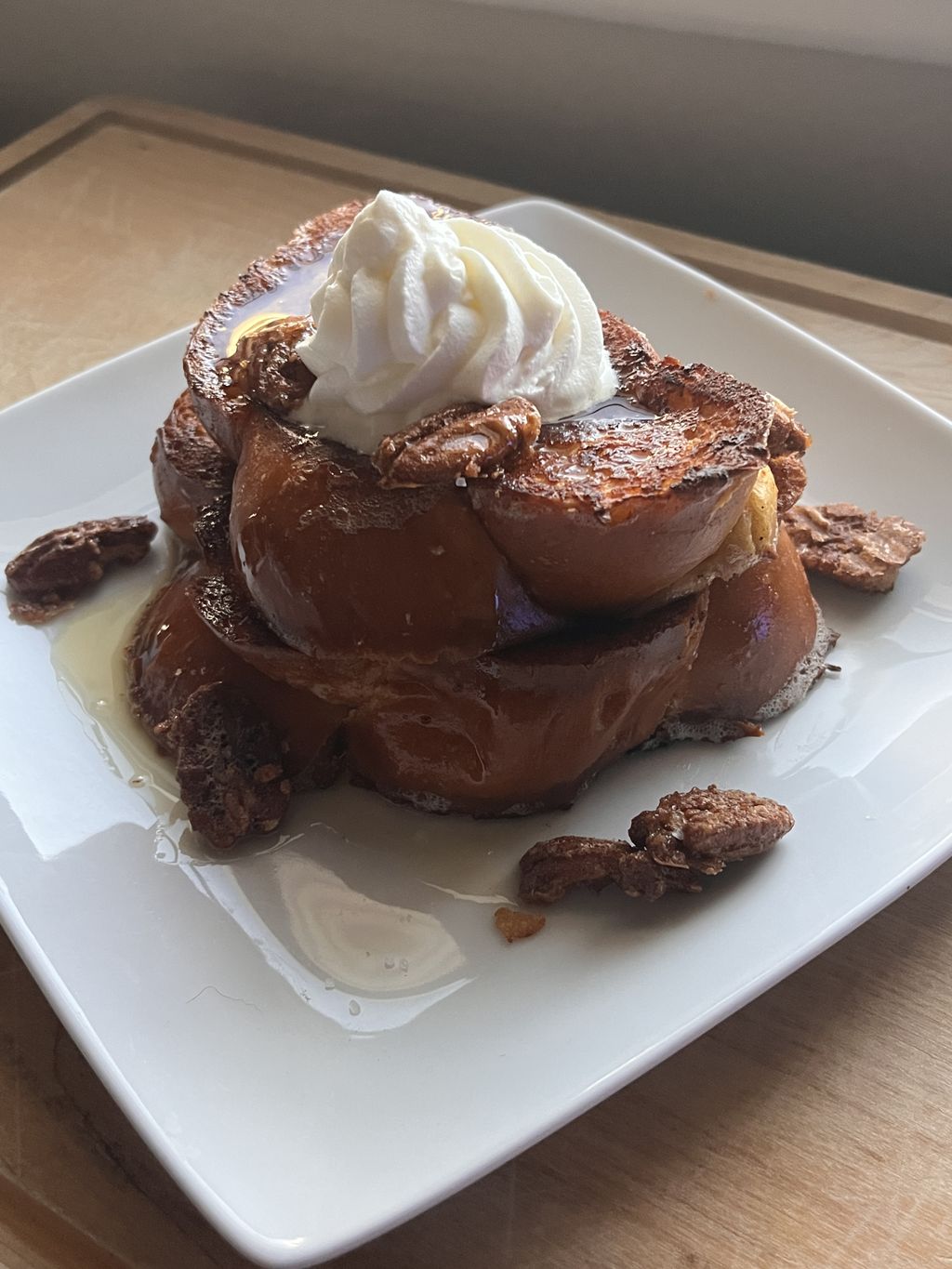 challah French toast with a candy pecan and cream 