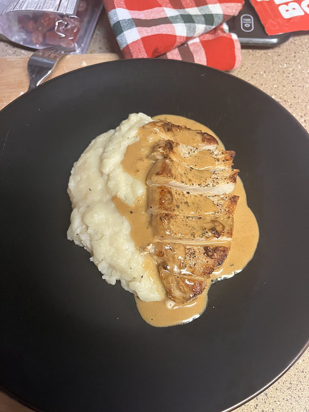 pork chops with peppercorn sauce on whipped potato