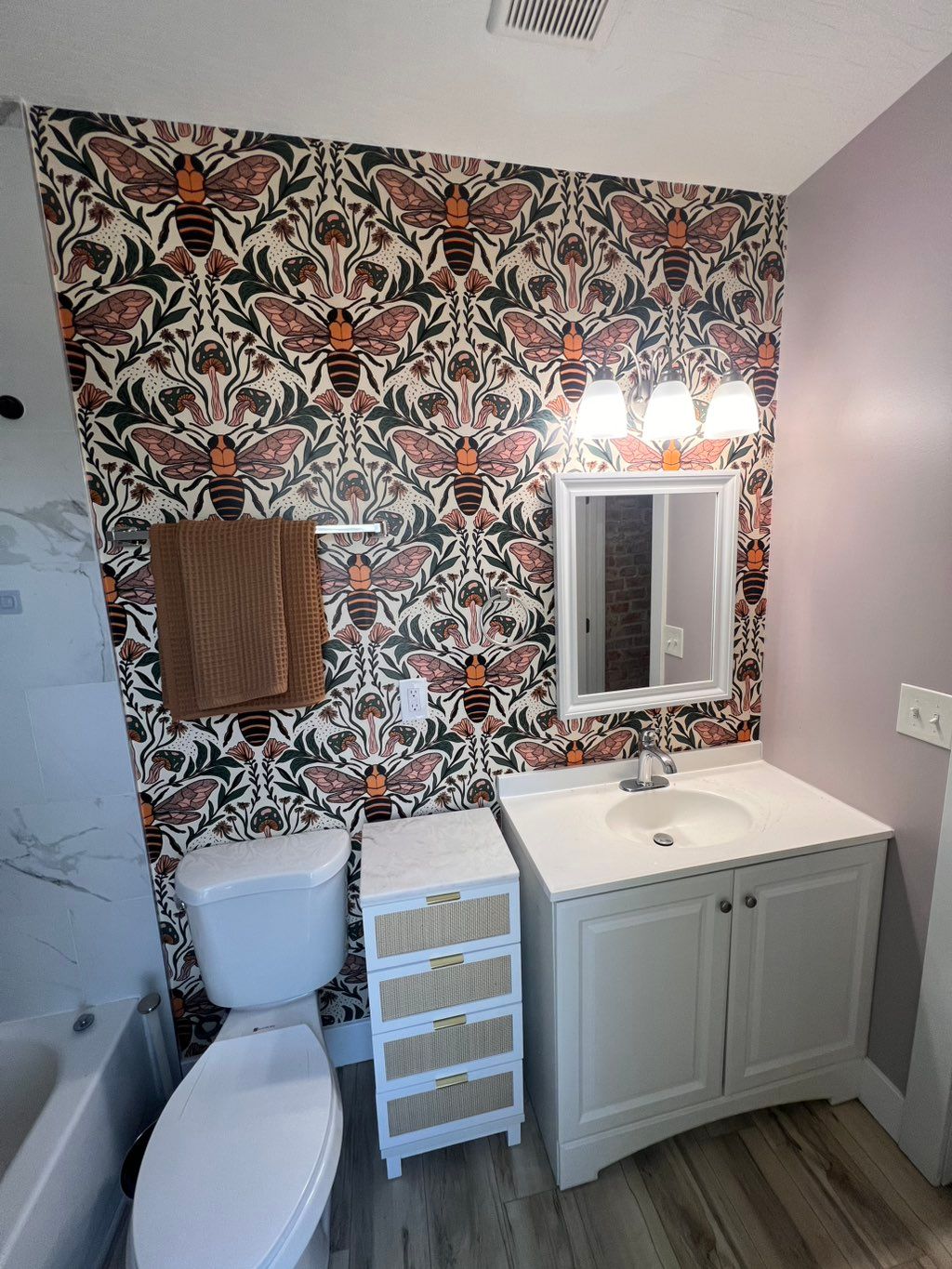 Peel-and-stick wallpaper installed on one bathroom