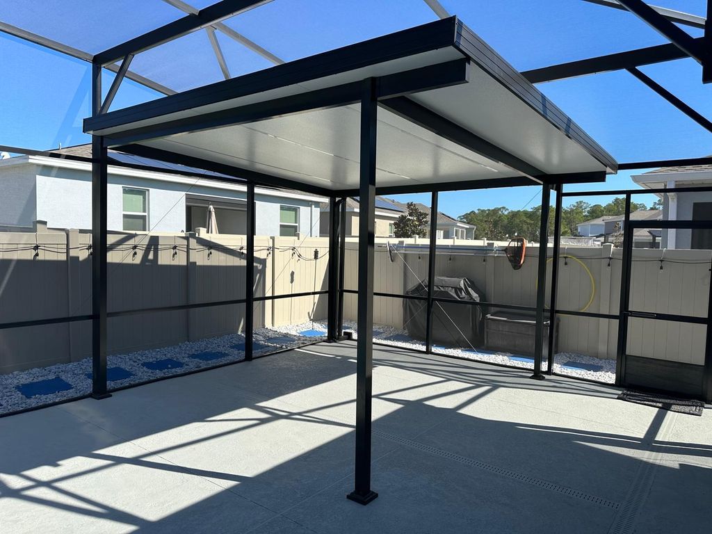 Insulated aluminum roof added inside the pool encl
