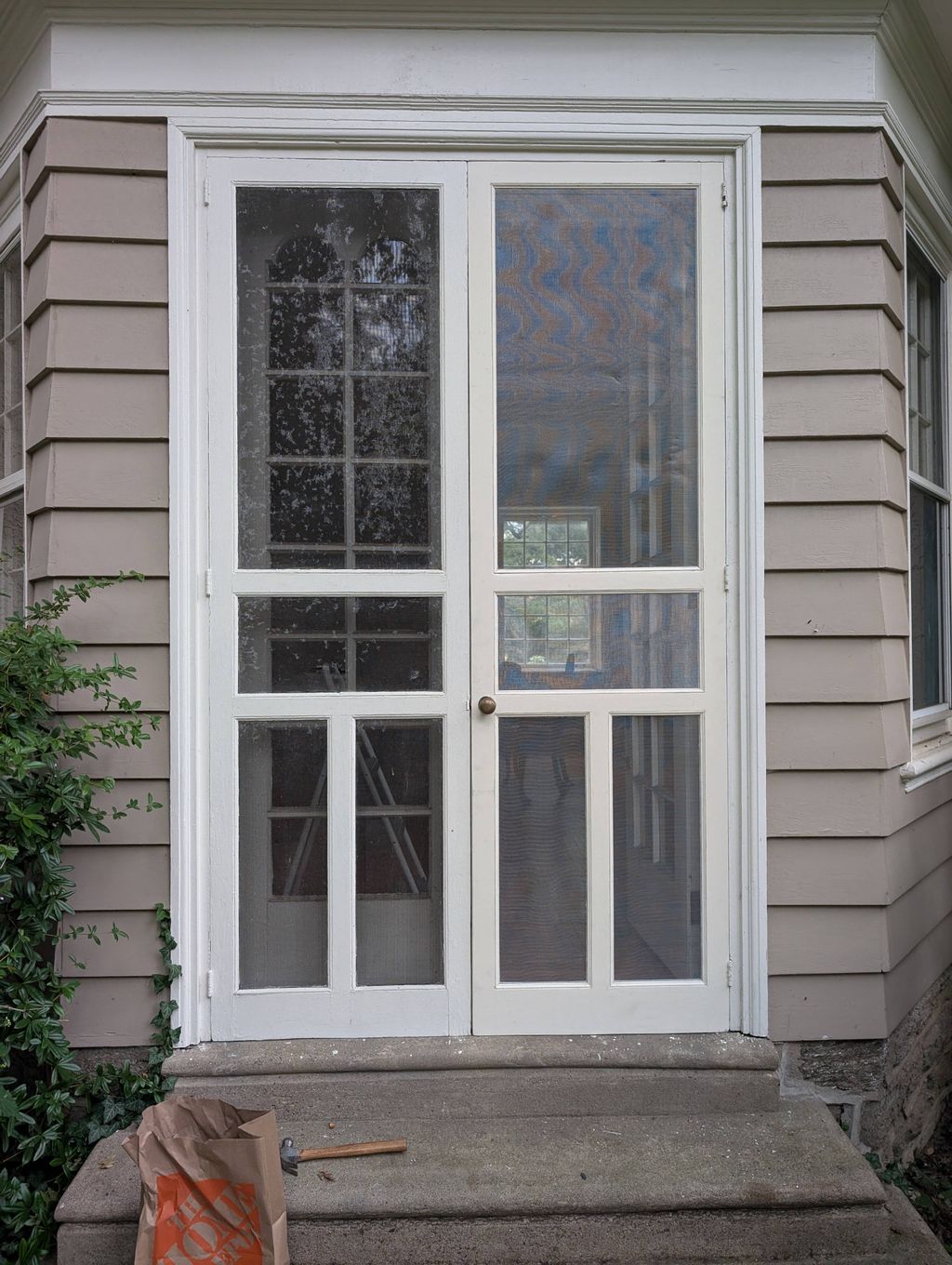 Restoration of wooden storm doors.