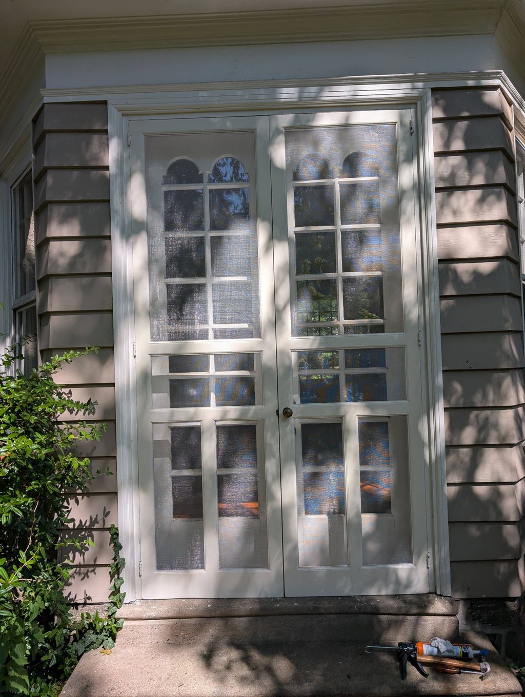 Restoration of wooden storm doors.