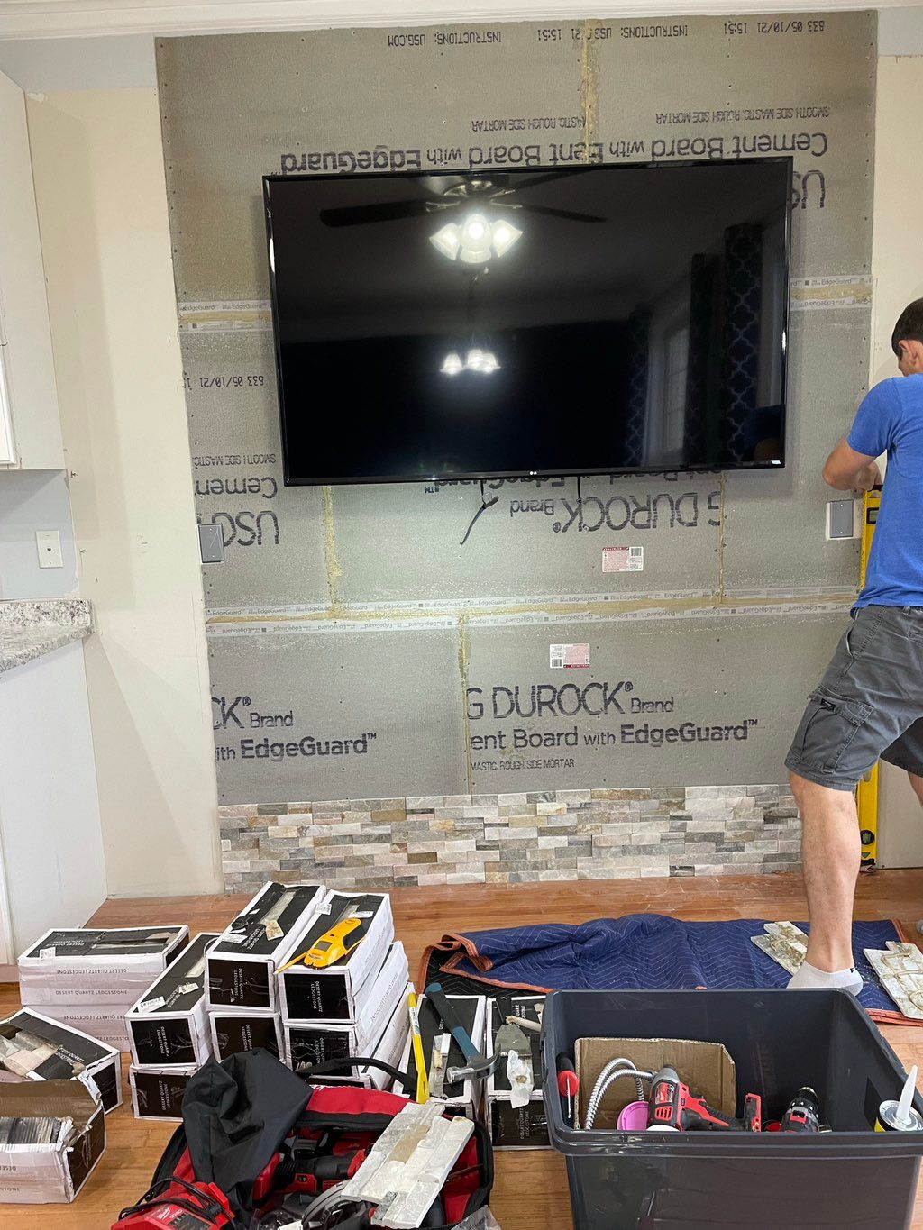 TV Wall Mount and Stone Accent Wall