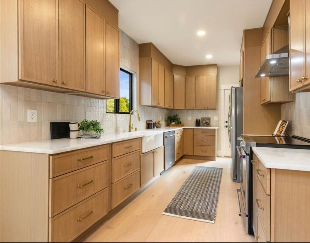 Modern kitchen remodel with custom cabinets and qu