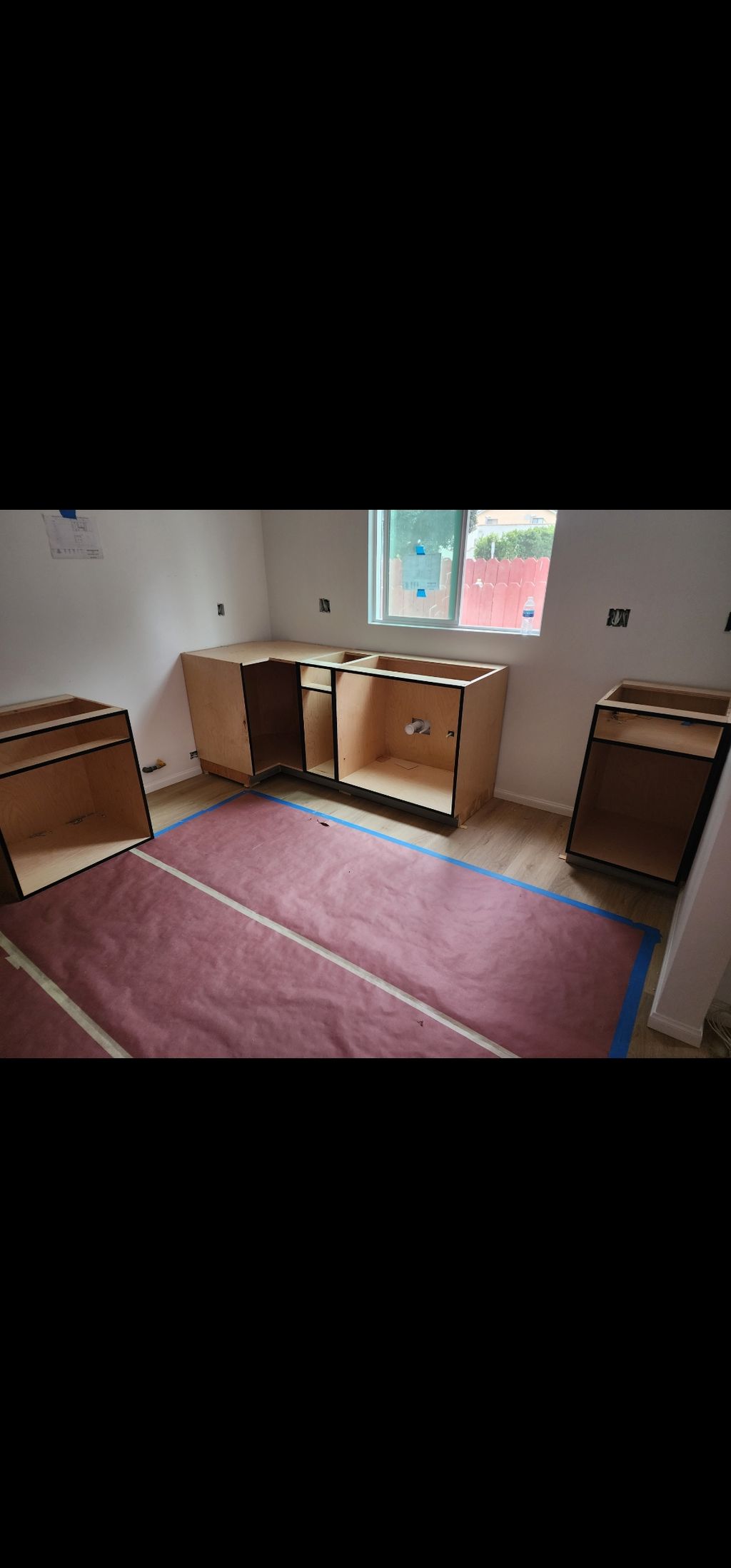 #1 Before: Raw kitchen cabinets installed