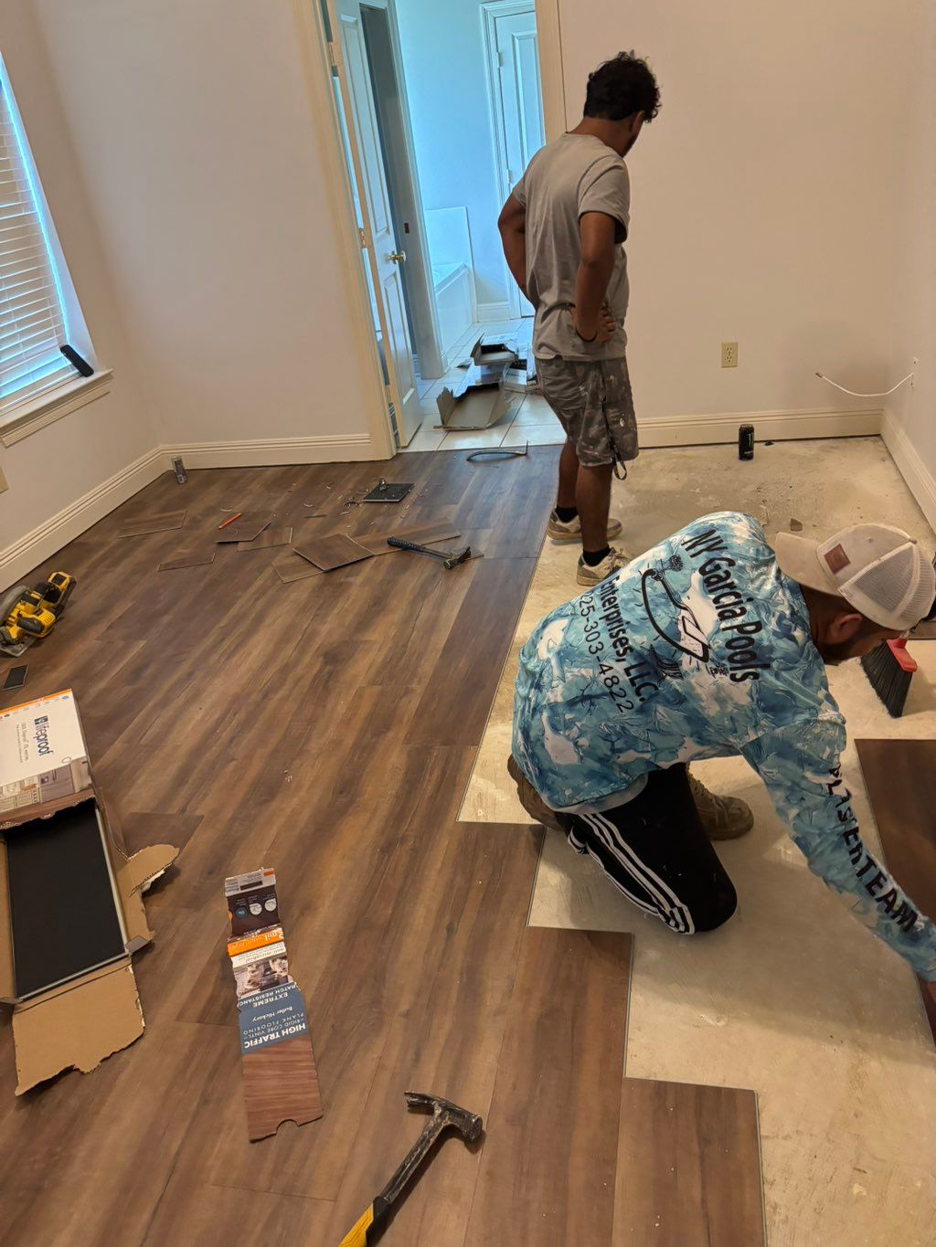 Our guys installing vinyl plank flooring we recomm