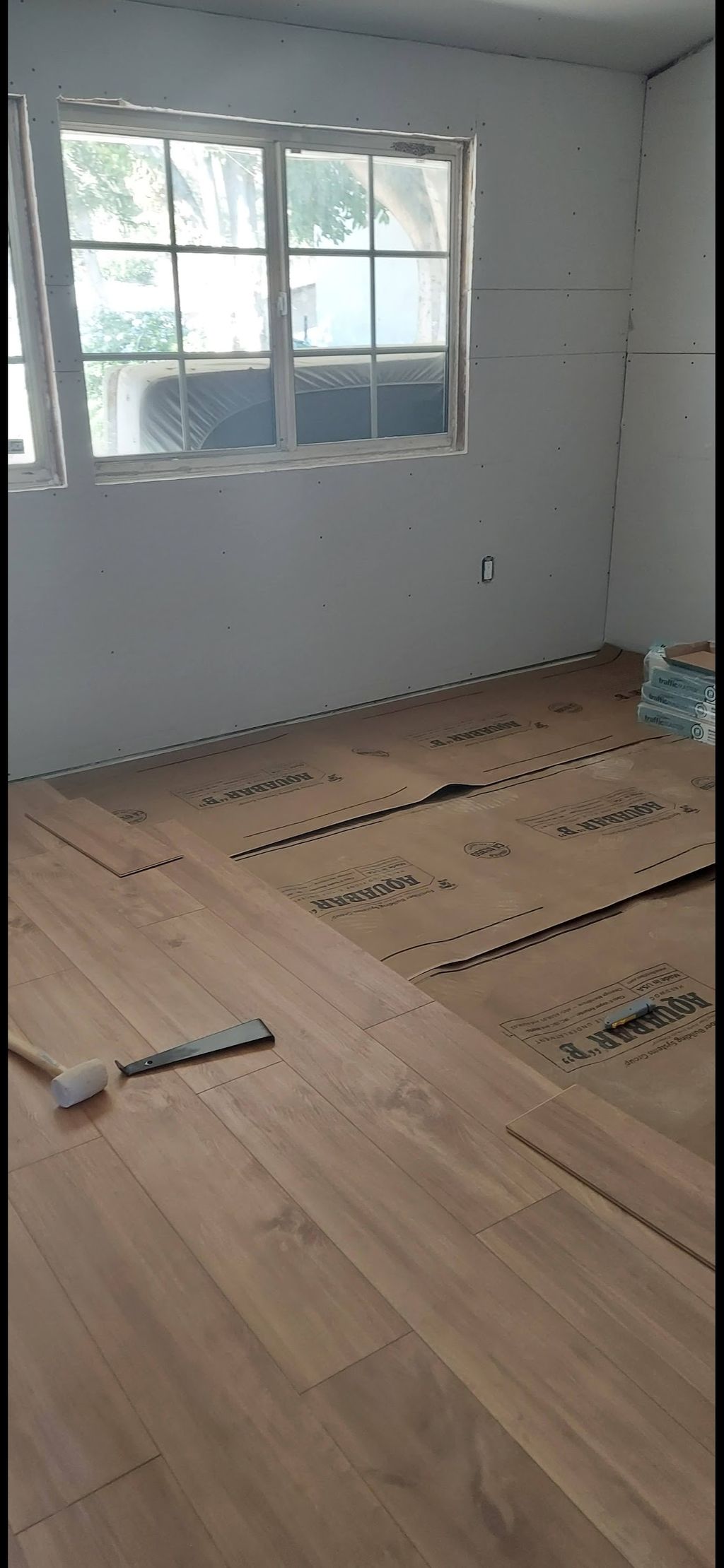 laminate installed over cement foundation.