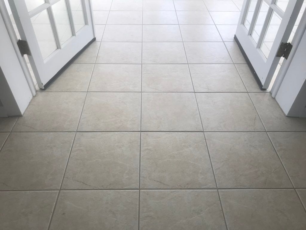 Broken tile replaced, entire floor cleaned (After)