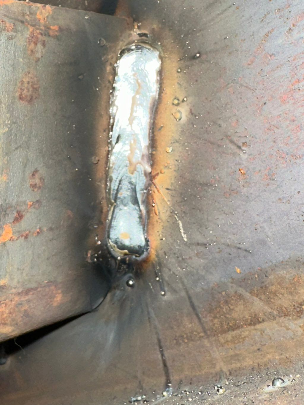 Vertical going down solid wire mig