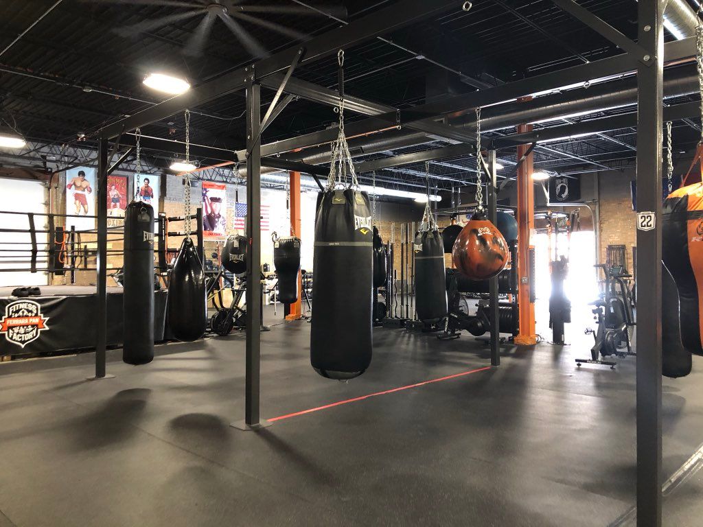 Long bags and boxing ring for boxing or kickboxing