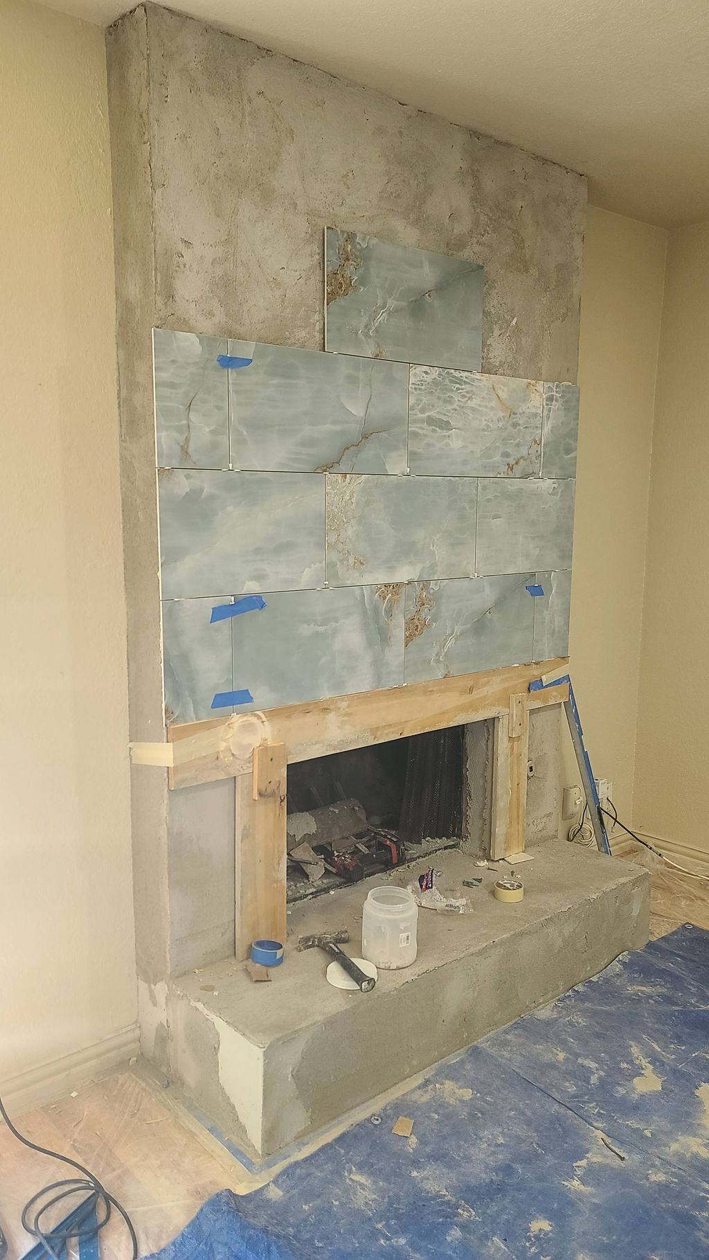Process of a fireplace tile installation 
