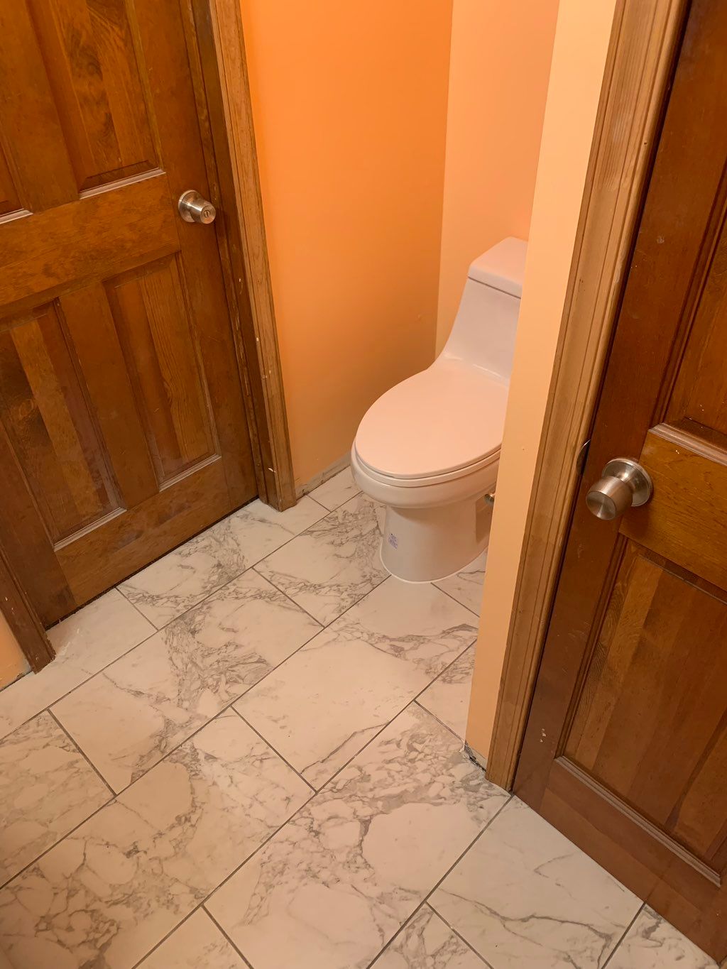 Toilet installed and siliconed at base 