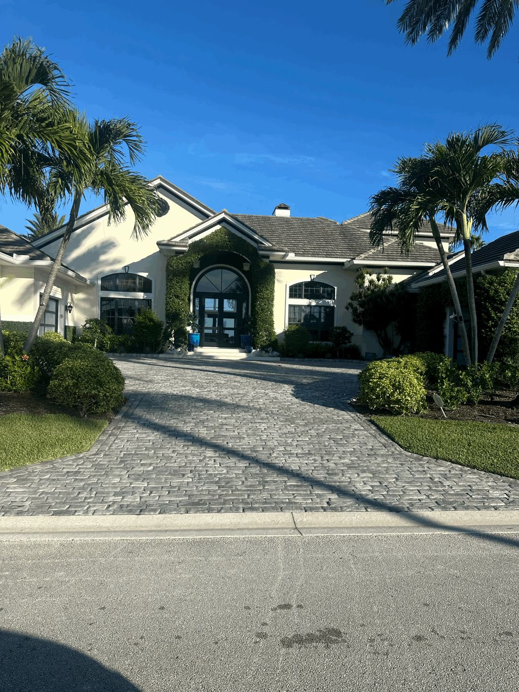 Paver Driveway | Custom hardscape design by Under 