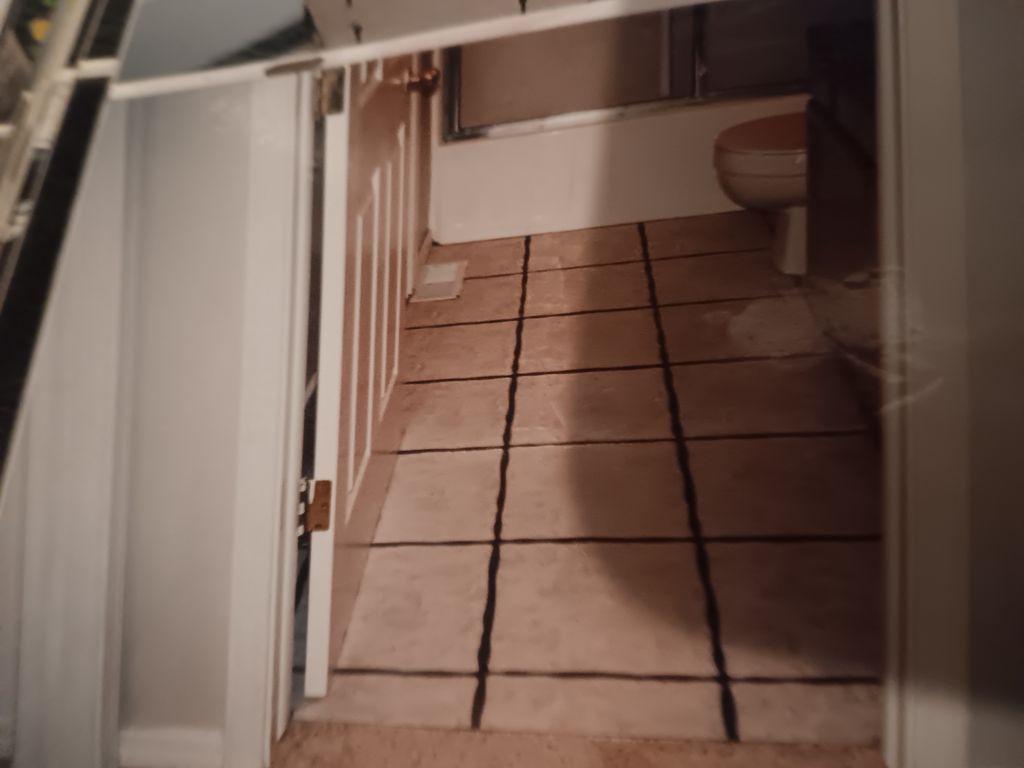 bath room floor tile install with scalloped tile