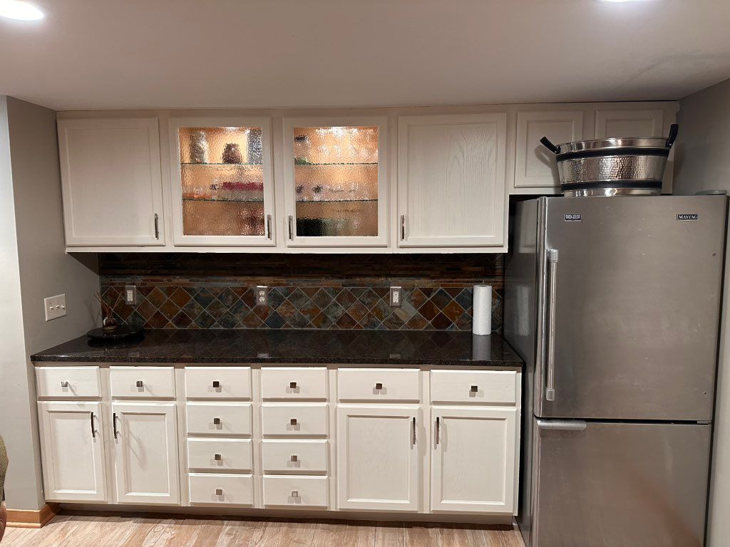 Existing cabinets painted and door handles and kno