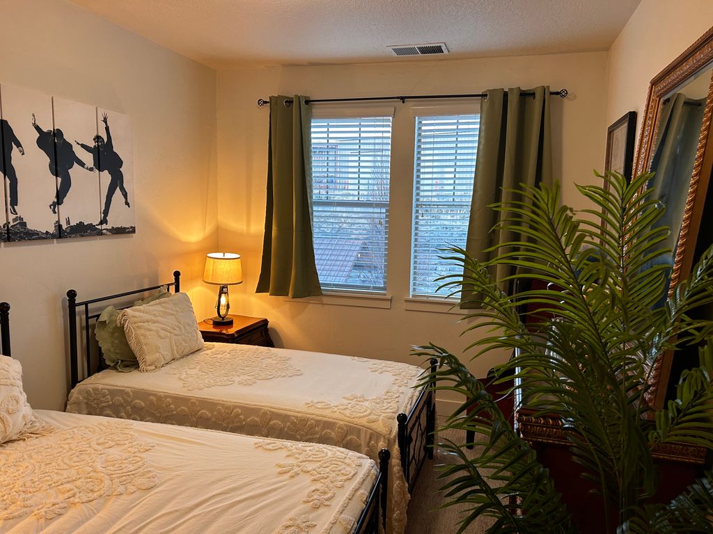 Beds, picture, lamps, tree all put together 