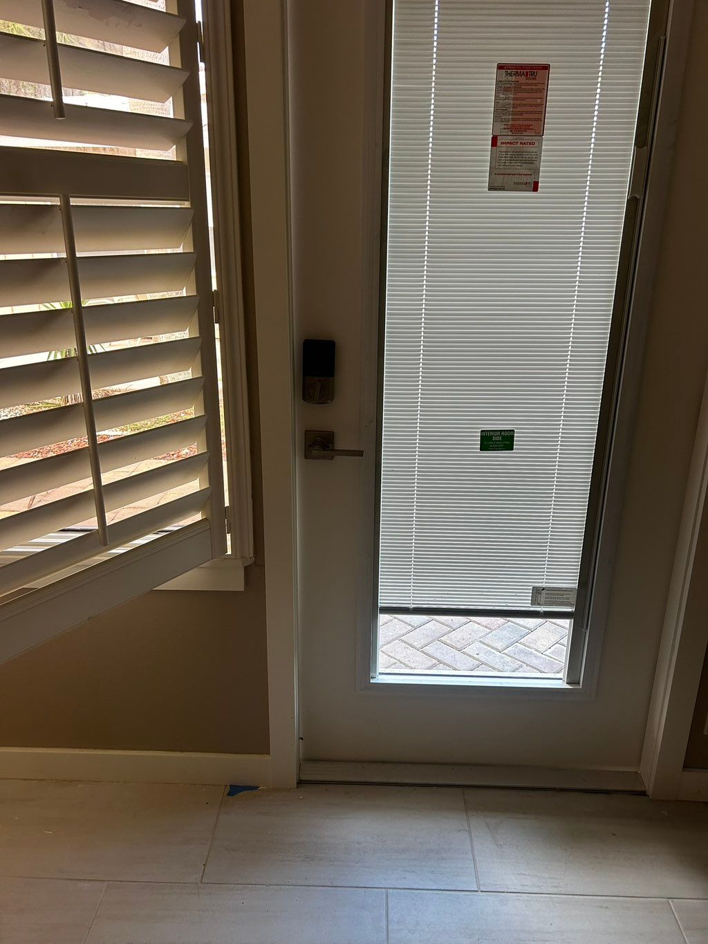 Patio door installation with impact glass