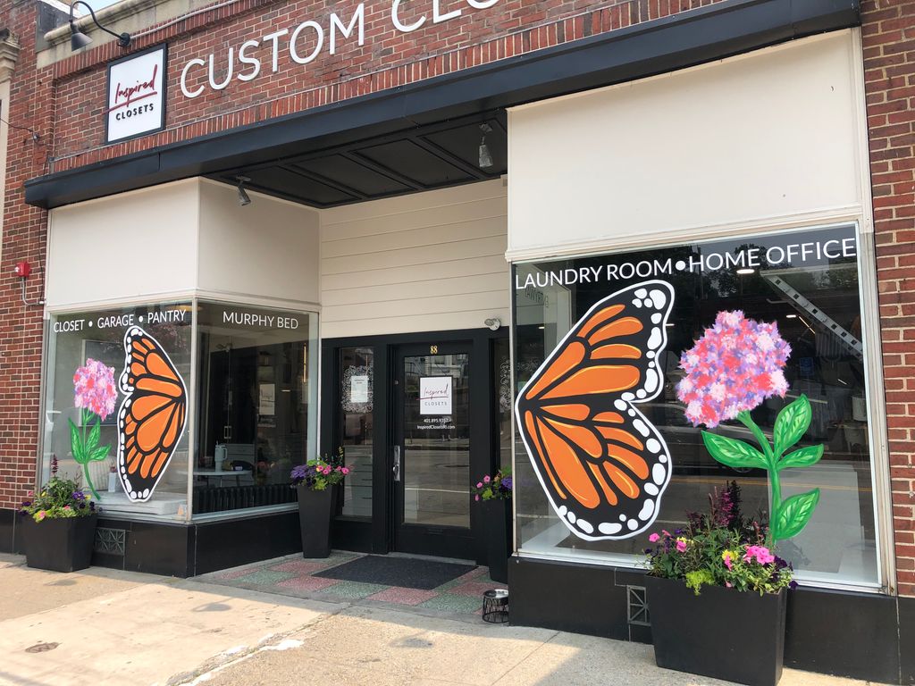 Monarch window mural, design studio store front