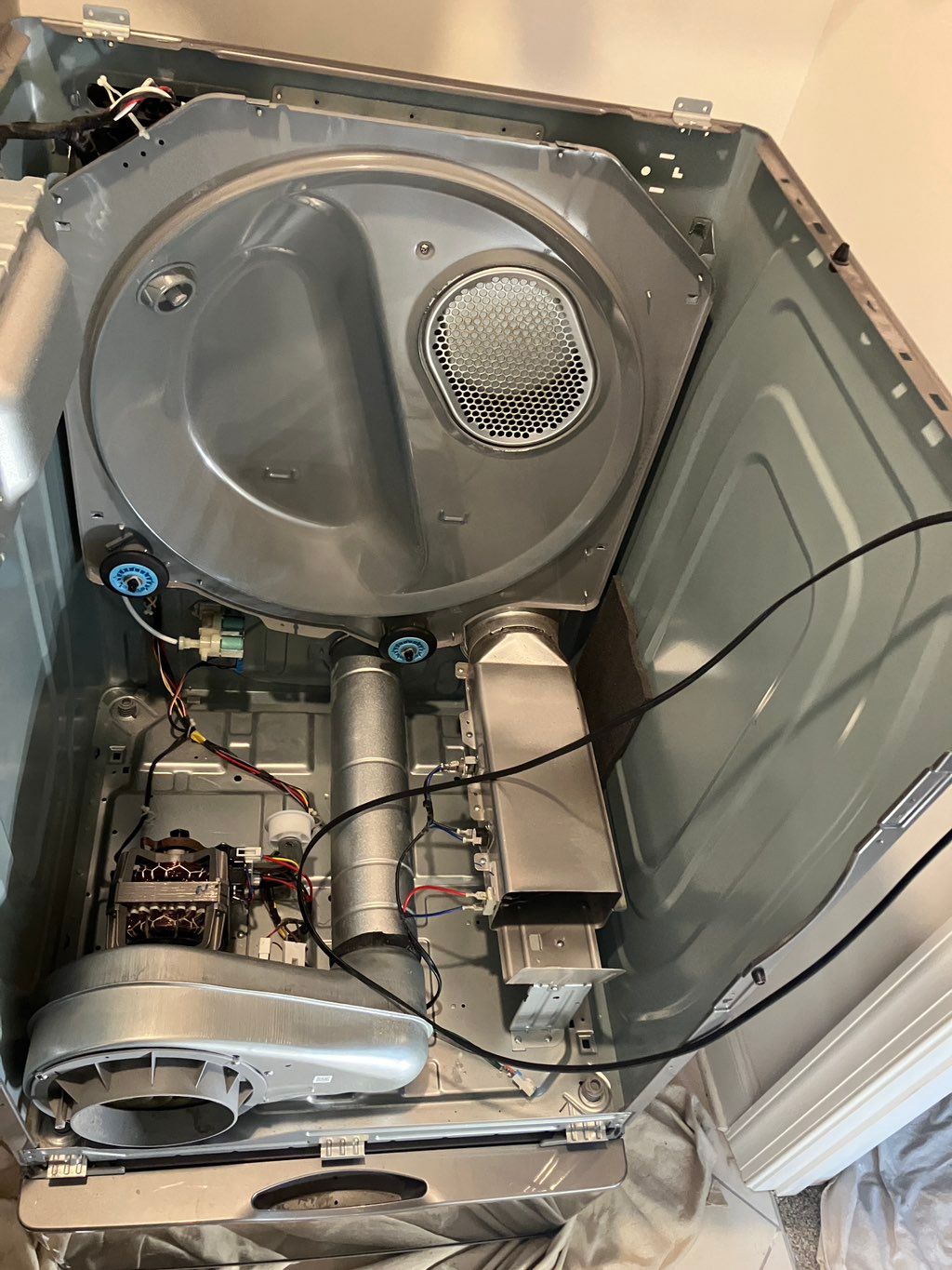 Replacing wheels, pully, belt, and springs and vac