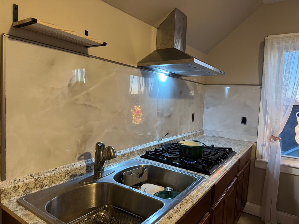 Hood vent installations for this cozy kitchen.