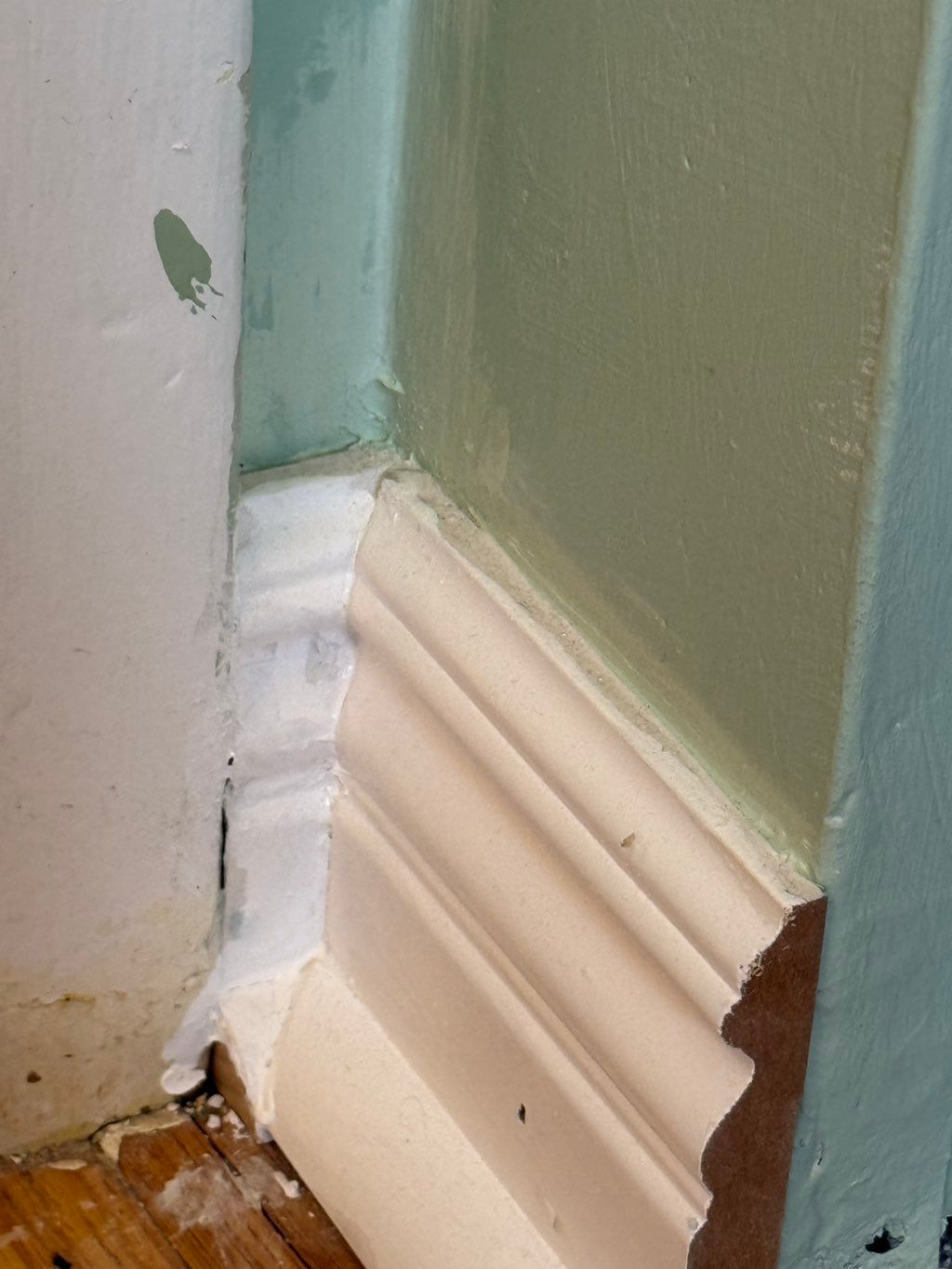 Some of my joint work on baseboard (the paint spla