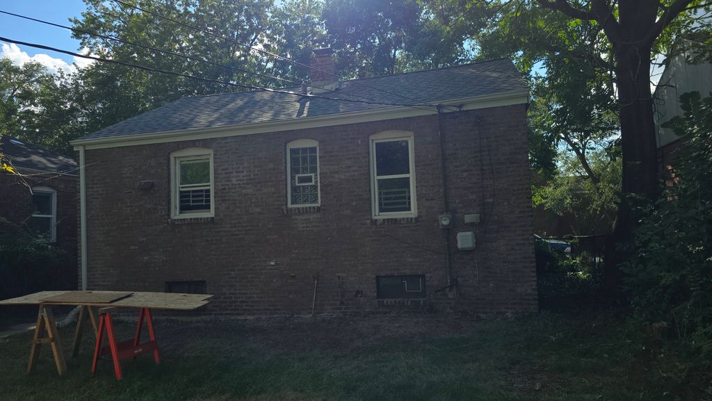 Replaced the New Roof & Tuckpointing on the rear o