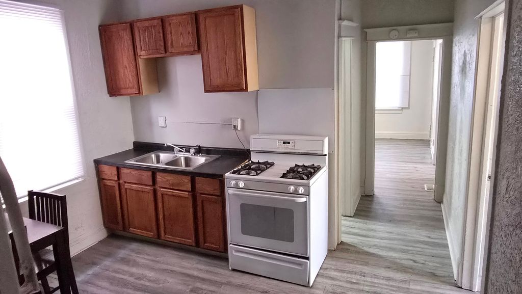 New vinyl flooring and kitchen cabinet repairs.