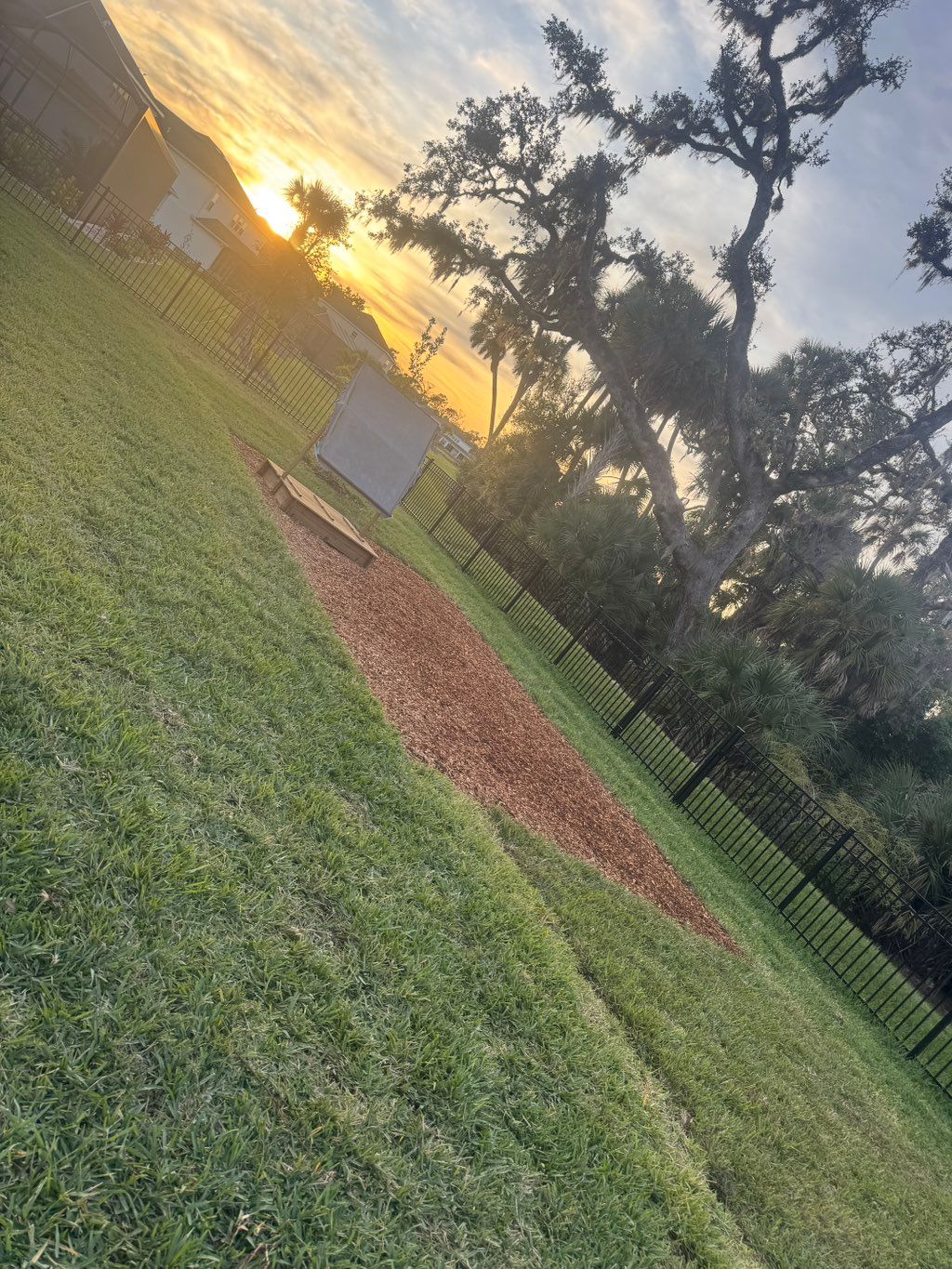 Add sod and new mulch bed for playground 