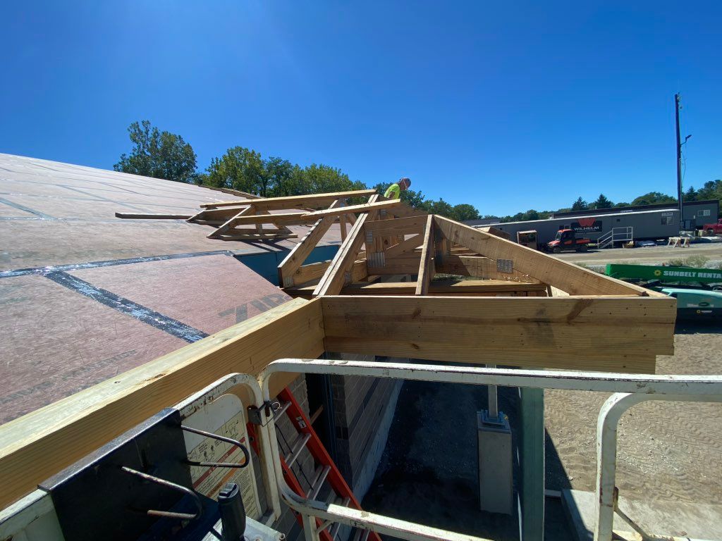 Installed a roof over a porch. 