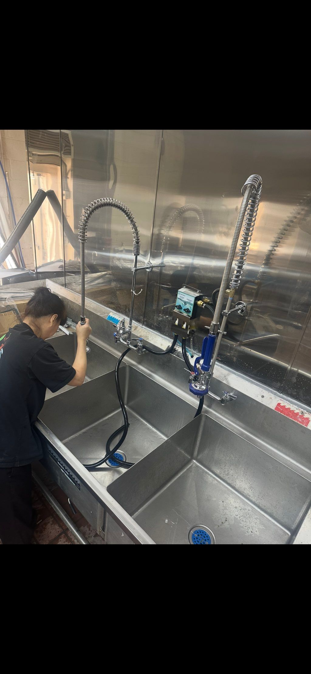 Commercial sink installation — tested and ready to