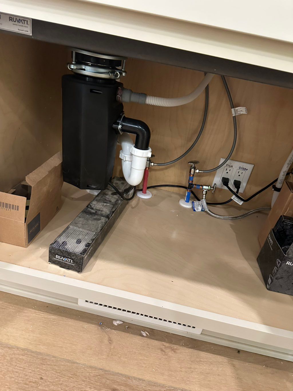 “Connected garbage disposal, drain lines, and wate
